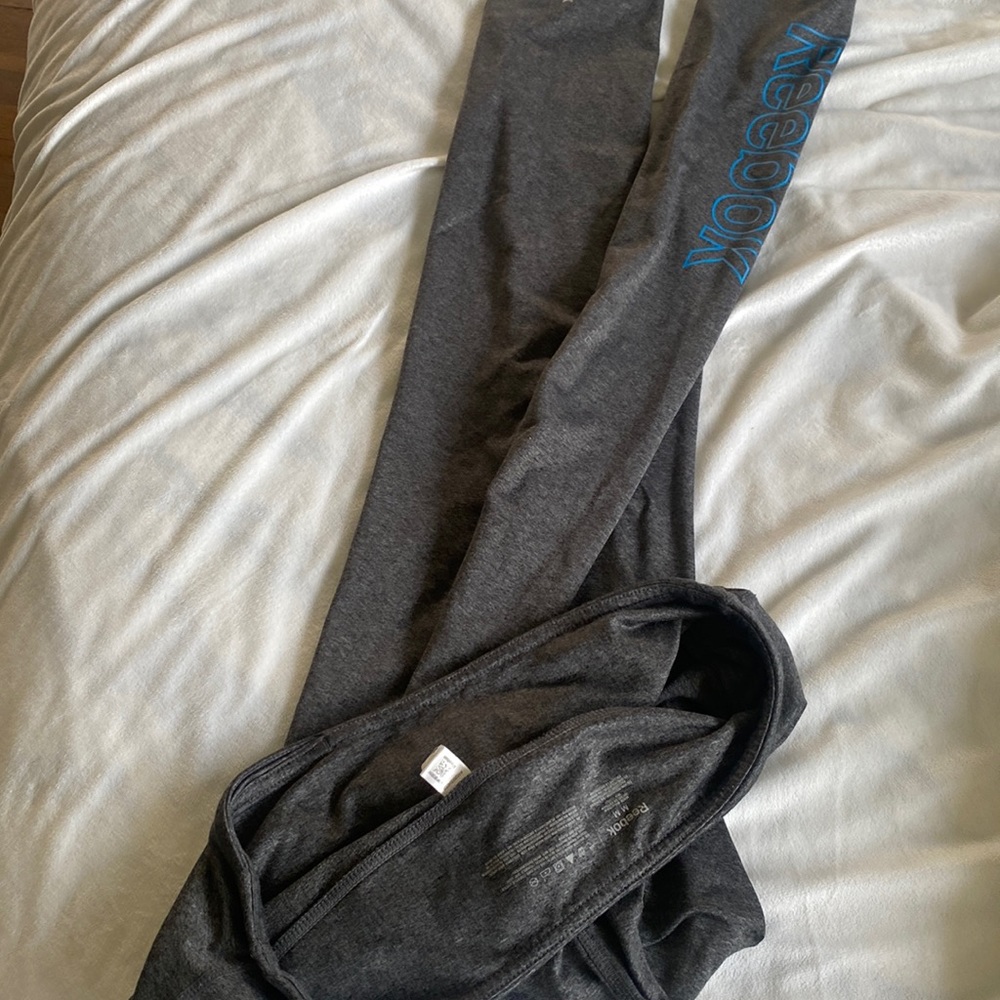 Like new. Fuzzy warm Reebok full length leggings. Logo on side